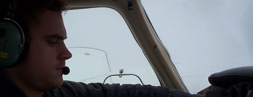 Pilot Ryan Gahan at the control of Langley Flying School's Piper Seneca during IMC instrument training near Blaine, Washington.